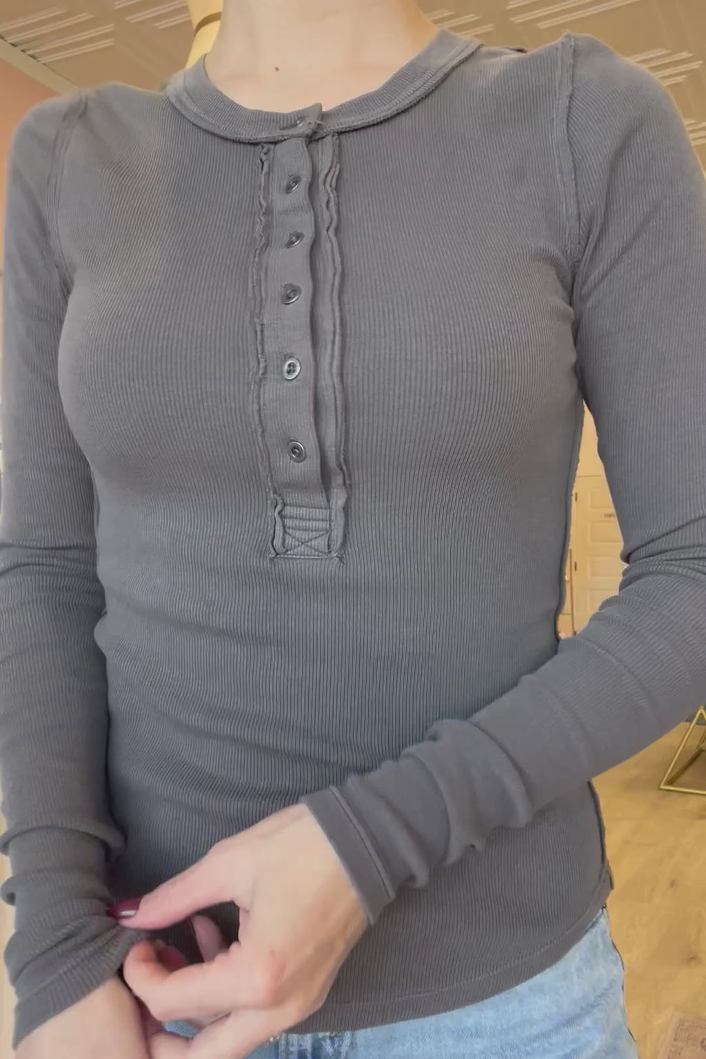 Marisa is seen wearing a size small in our gray, long-sleeve, henley top.