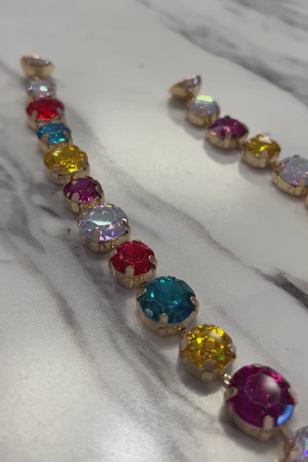 detailed video of multicolor gemstone magnetic clasp closure. 